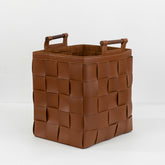 Close-up of Zola hand-woven bridle leather basket showing detailed craftsmanship and textured leather finish